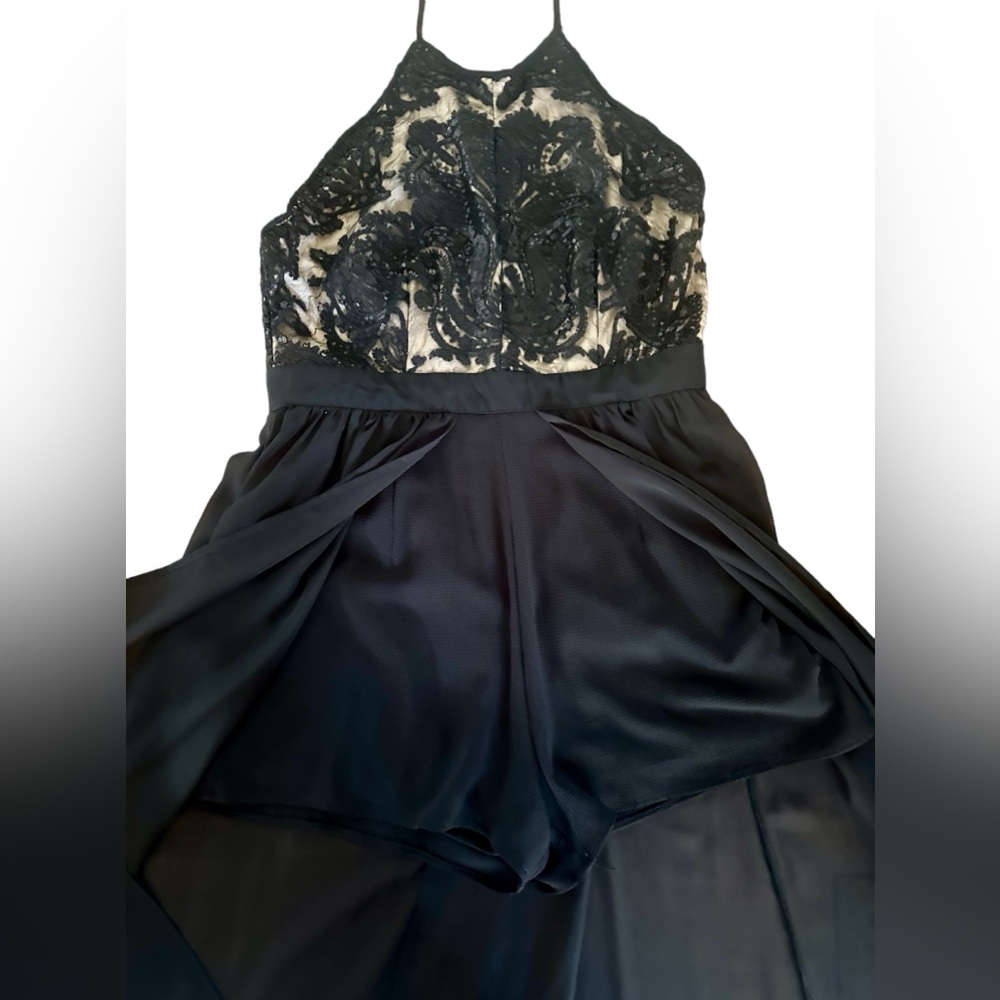 Francesca's Cate High Neck Maxi Romper This  features an embellished bodice.